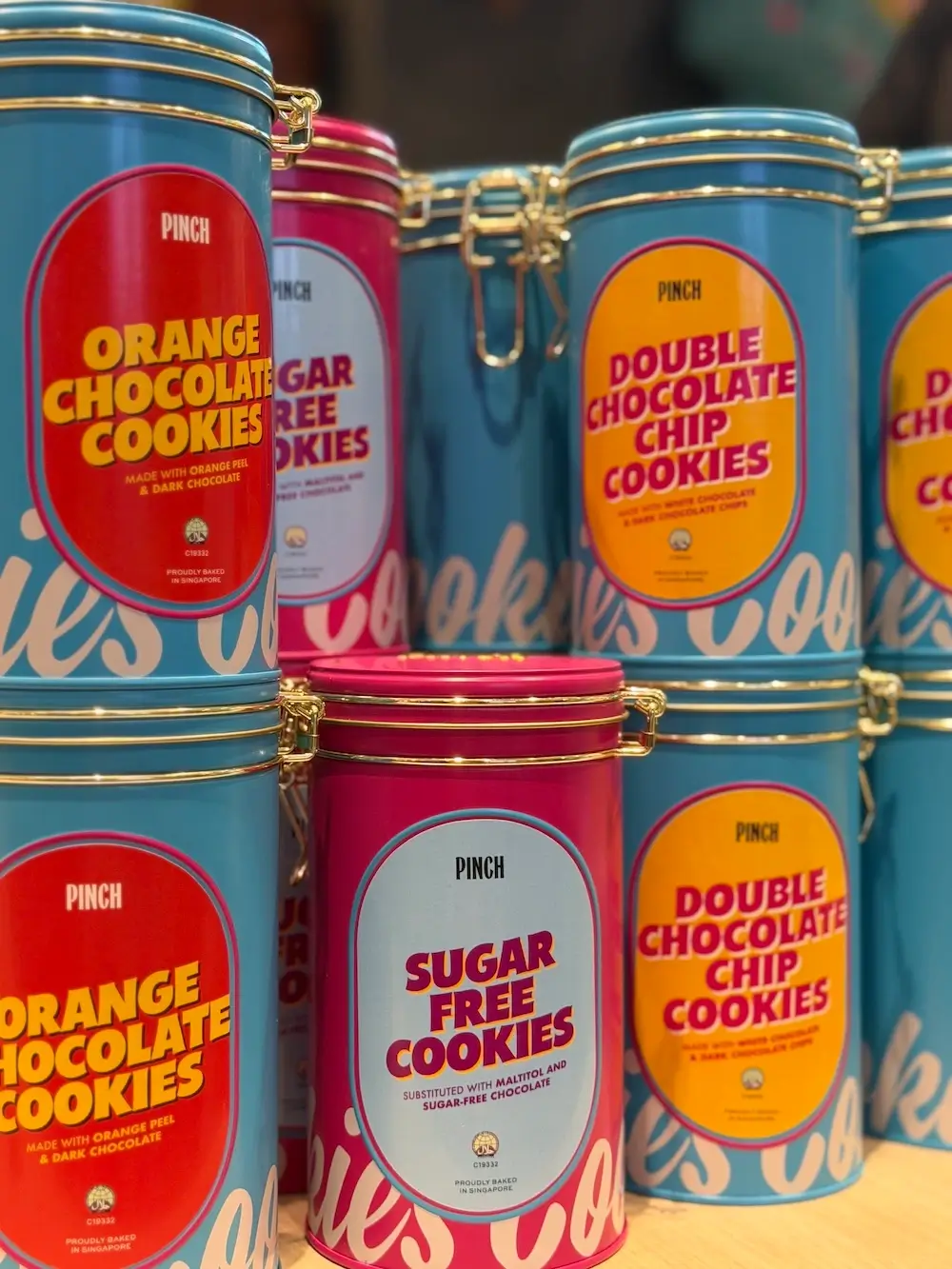 Pinch Bakehouse halal cookie tins including orange chocolate, double chocolate chip and sugar-free cookies